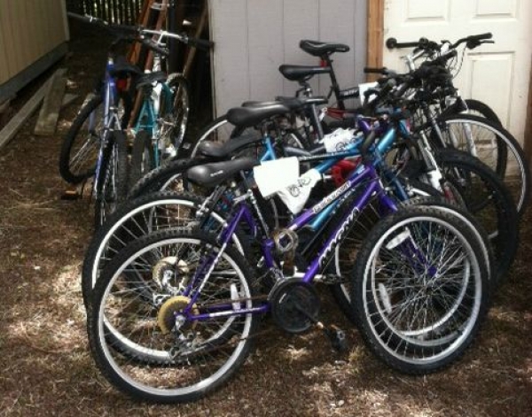 Catholic Charities Staff Mend Bicycles for Homeless